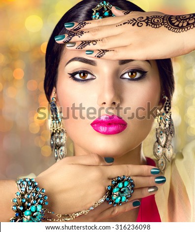 http://thumb1.shutterstock.com/display_pic_with_logo/195826/316236098/stock-photo-beautiful-fashion-indian-woman-portrait-with-oriental-accessories-earrings-bracelets-and-rings-316236098.jpg
