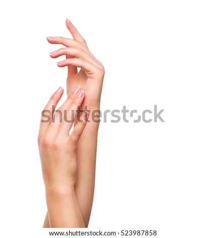 Beautiful Woman Hands. Spa and Manicure concept. Female hands with french manicure. Soft skin, skincare concept. Beauty nails. Isolated on white background