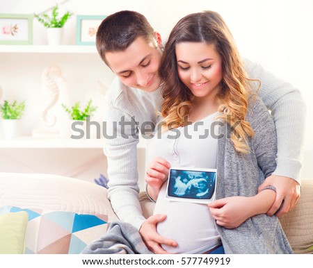 Stock Photo Happy Young Couple Expecting Baby Beautiful Pregnant Woman And Her Husband Together Holding 577749919
