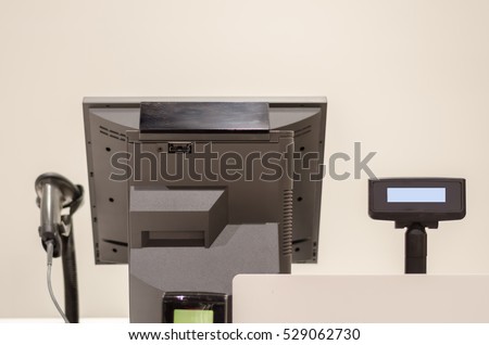 cash registers, bar code reader and monitor turn from the back