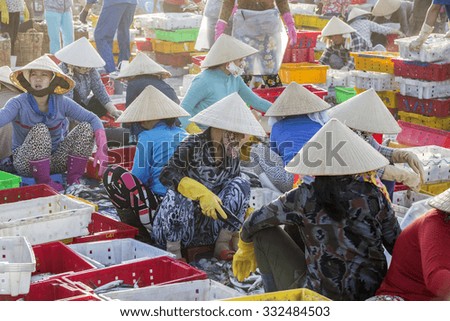 VUNG TAU, VIETNAM - AUG 23,2015: Fishermen on beach at the Fishing Village Long Hai, Vietnam.