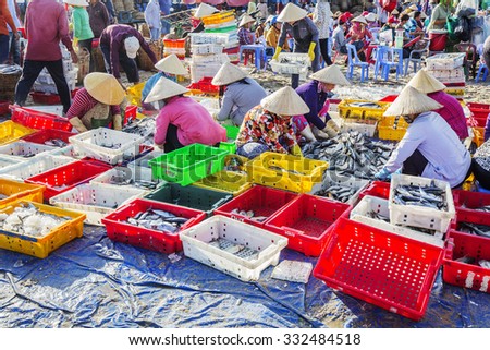 VUNG TAU, VIETNAM - AUG 23,2015: Fishermen on beach at the Fishing Village Long Hai, Vietnam.