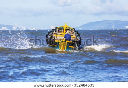 VUNG TAU, VIETNAM - AUG 23,2015: Fishermen on boat at the Fishing Village Long Hai, Vietnam.