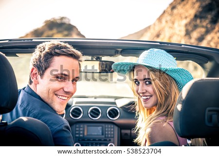 https://thumb1.shutterstock.com/display_pic_with_logo/1993499/538523704/stock-photo-couple-of-lovers-driving-on-a-convertible-car-newlywed-pair-on-a-romantic-date-538523704.jpg