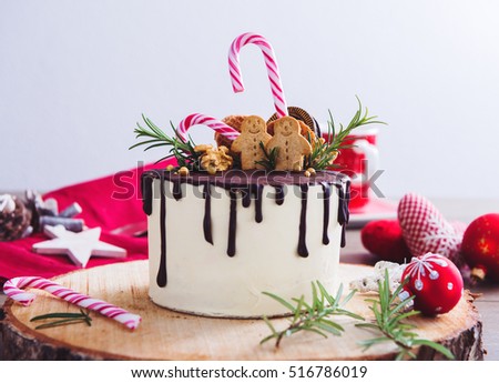 Homemade Christmas Cake On A Rustic Wood Stand And Festive Decoration Homemade Christmas Cake On A Rustic Wood Stand And Festive Decoration