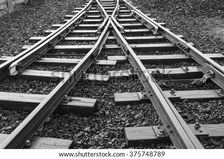 stock-photo-two-railway-tracks-merge-375748789.jpg
