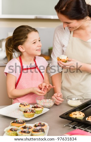 Woman Decorating Cupcakes cupcake decorating stock photos, royalty-free images & vectors Woman Decorating Cupcakes cupcake decorating stock photos, royalty-free images & vectors
