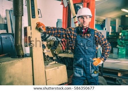 forklift heavy duty work forklift and his caucasian operator in his 30s - Duties Of A Forklift Operator forklift heavy duty work forklift and his caucasian operator in his 30s - Duties Of A Forklift Operator