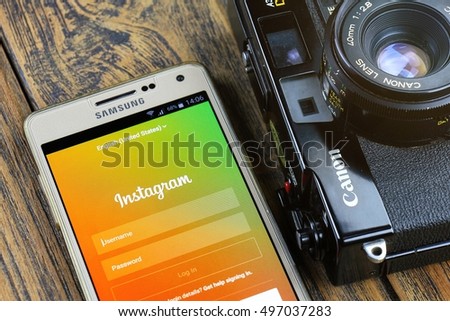 BANGKOK, THAILAND - 7 OCTOBER 2016: Samsung A5 Smartphone close up display instagram application on the screen and Canon A35 vintage film camera, Instagram is a photo-sharing app for smartphone.