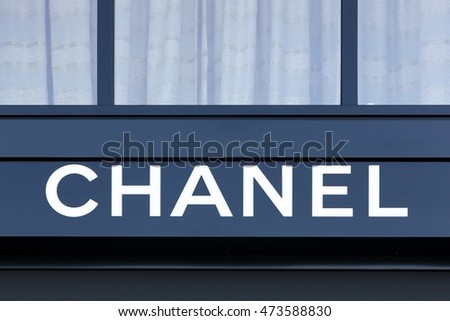 Geneva, Switzerland - August 14, 2016: Chanel logo on a wall. Chanel is a French high fashion house that specializes in haute couture and ready-to-wear clothes, luxury goods and fashion accessories