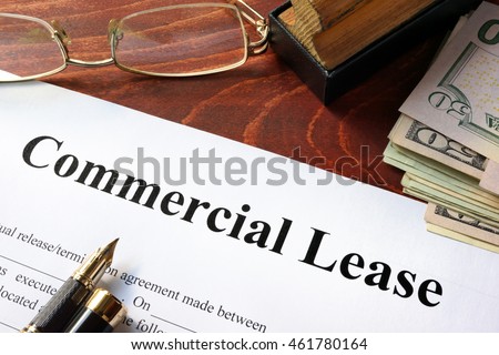 What are some common terms used in commercial lease contracts?