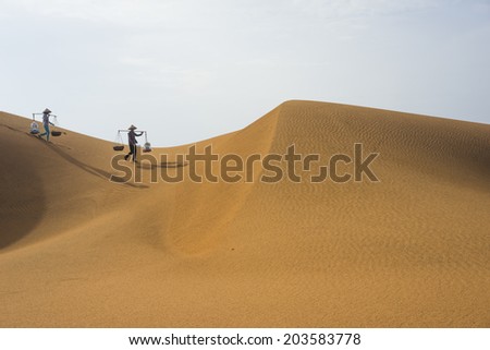 Vendor sell instant food on Mui Ne red sand hill in Binh Thuan, Vietnam. Binh Thuan has long seashore with a lot of beautiful beach and resort