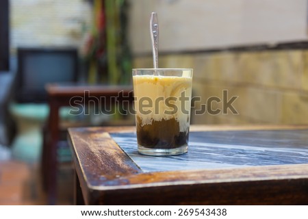 A cup of Giang egg coffee in Hanoi, found in 1946. The coffee is brewed in a small cup with a filter before the addition of a well-whisked mixture of the yolk and other ingredients