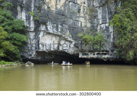 Ninh Binh, Vietnam - May 16, 2015: Exterior view of natural cave on Ngo Dong river, Tam Coc, Ninh Binh