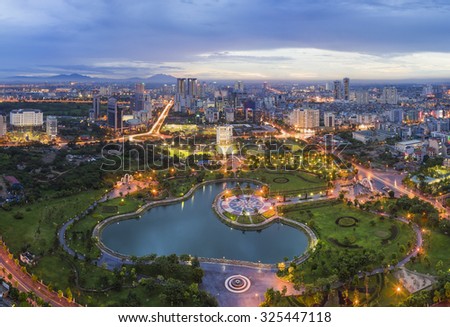 Hanoi skyline cityscape at twilight period. Aerial view of Cau Giay park, west of Hanoi
