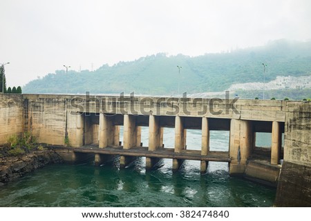 Hoa Binh, Vietnam - Jan 14, 2016: Outlet discharge gate in Hoa Binh Hydroelectricity Plant. The plant built from 1979 with 8 machines provides 1920 MW, equal to one third of productivity of Vietnam.