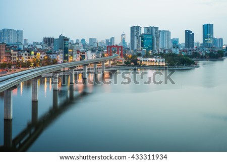 Aerial view of Hanoi cityscape by twilight period, with Dong Da lake and under construction Cat Linh - Ha Dong elevated railway
