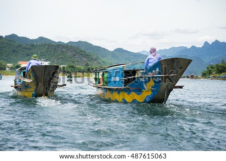 Quang Binh, Vietnam - June 16, 2016: Semi power/rowing tourism boat on river to Phong Nha cave, Phong Nha - Ke Bang national park, Quang Binh, Vietnam