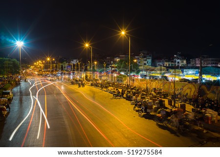 Hanoi, Vietnam - July 23, 2016: Aerial view of early morning business outside of Long Bien fruit market at 4:40am, Yen Phu street.