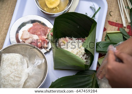 Making Chung cake by hands closeup, Chung cake is the most important traditional Vietnamese lunar New Year (Tet) food.