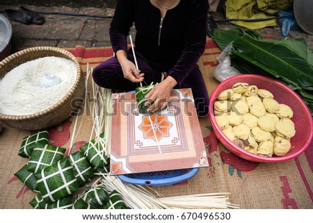 Making Chung cake by female craftsman closeup. Traditional Vietnamese New Year (Tet) food.