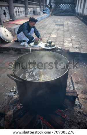 Hanoi, Vietnam - Jun 22, 2017: Cooking Chung cake outdoor in communal house at So village, Quoc Oai district. , square glutinous rice cake, Vietnamese lunar new year food