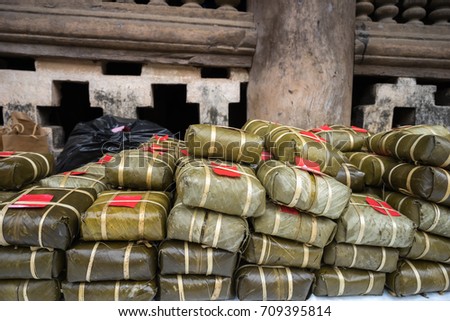 Pile of Chung cakes, Cooked square glutinous rice cake, Vietnamese new year food. Vintage background
