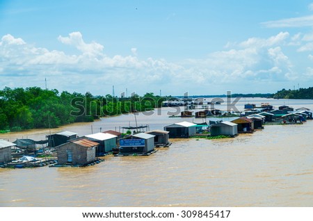 Ben Tre, Vietnam - August 11, 2015: floating homes on the Tien Giang River in the province of Ben Tre, in the Mekong Delta region of southern Vietnam.