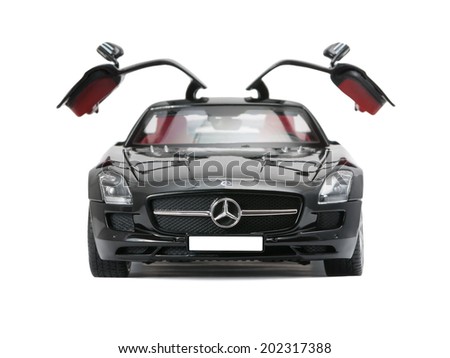 ALMATY, KAZAKHSTAN - june 22, 2014 - Collectible toy car Mercedes-Benz SLS Sedan with open doors isolated on white background