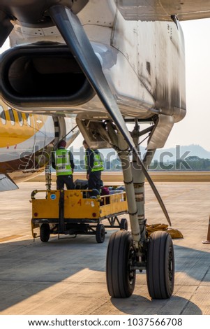 The staff are bringing luggage to the Nok Air airplane before leaving in the afternoon at Chiang Mai airport , Chiang Mai province , Thailand.
26 Feb 2018
