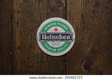 Velke Karlovice, Czech -July 10,2015: Berrmats from Heineken Lager Beer in vintage background , it was first brewed by Gerard Adriaan Heineken in 1873