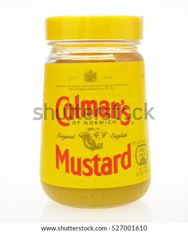 LONDON, UK -5 OCTOBER 2016: A shot of an unopened jar of Colmans Mustard over a plain white background, on 5 October 2016. The product is made by the Unilever company.
