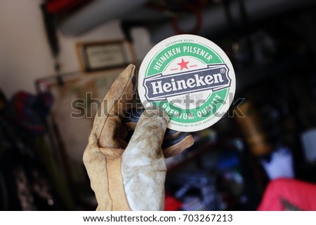 AMELAND, DUTCH - 26 AUGUST 2017.: Beer mat HEINEKEN, it was first brewed by Gerard Adriaan Heineken in 1873