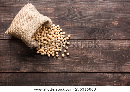 Top view soybean on wooden background and empty space