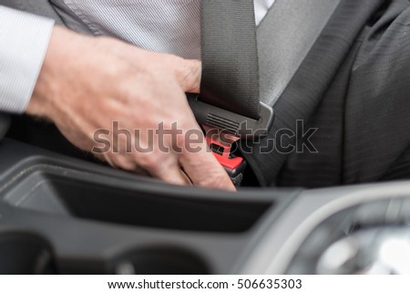 stock-photo-driver-buckling-his-seat-belt-506635303.jpg