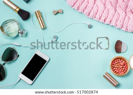 women's clothes on the turquoise background, layout female table