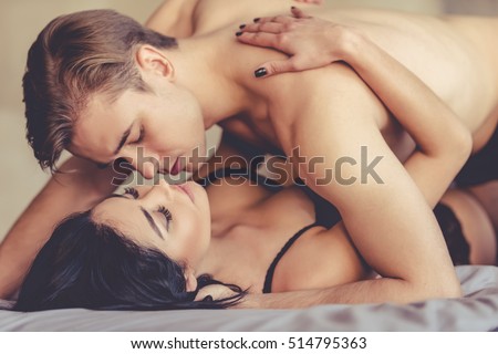 Young couple having sex in bed