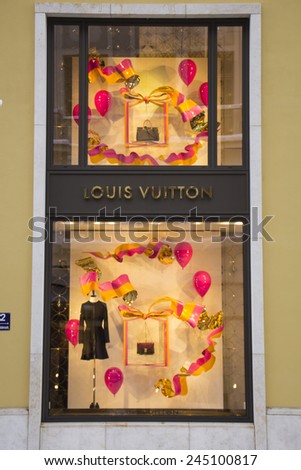 MUNICH - DEC 31: Shop windows are decorated at the Louis Vuitton store in Munich, Germany on December 31st, 2014.
