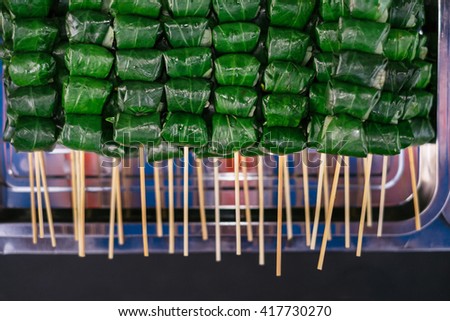 Asian street food. Traditional spring rolls in vietnamese night market
