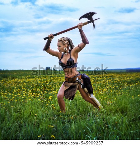 https://thumb1.shutterstock.com/display_pic_with_logo/2233535/545909257/stock-photo-beautiful-athletic-woman-in-the-image-of-an-ancient-barbarian-warrior-on-summer-nature-background-545909257.jpg