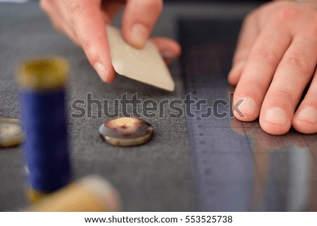 Tailor man working in his tailor shop
