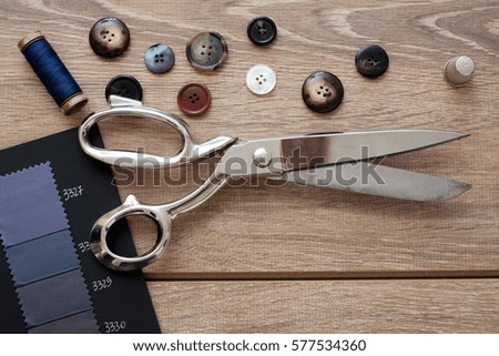 Tailor tools isolated on wooden background