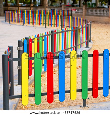 stock-photo-colourful-rows-of-painted-wood-on-a-playground-fence-38717626.jpg