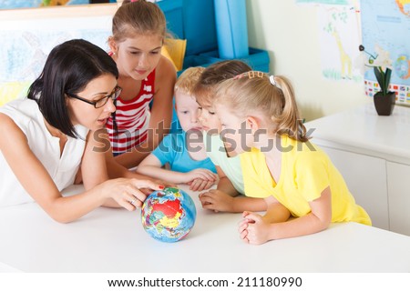 Pre-school children in the classroom with a teacher