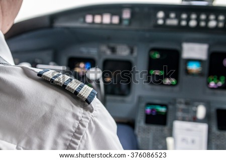Pilot in cockpit flying