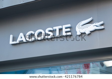 MULHOUSE - France 15 May 2016 - retail of the Crocodile shaped logo of the brand "Lacoste" the french brand of sportwear signage