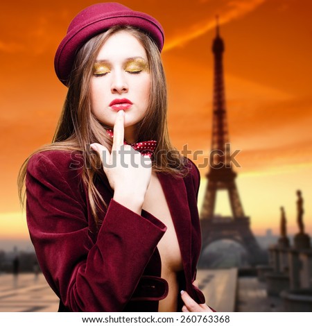 https://thumb1.shutterstock.com/display_pic_with_logo/2282018/260763368/stock-photo-portrait-of-romantic-sexy-beautiful-young-lady-topless-in-elegant-coat-and-red-hat-on-eiffel-tower-260763368.jpg