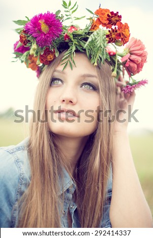 https://thumb1.shutterstock.com/display_pic_with_logo/2282018/292414337/stock-photo-portrait-closeup-of-beautiful-young-woman-wearing-flower-crown-having-fun-relaxing-looking-up-on-292414337.jpg