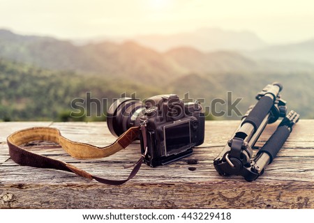 Travel photographer equipment with beautiful landscape on the background, Traveling and Relax Concept.