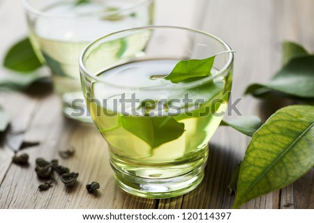 glass cup with fresh green tea